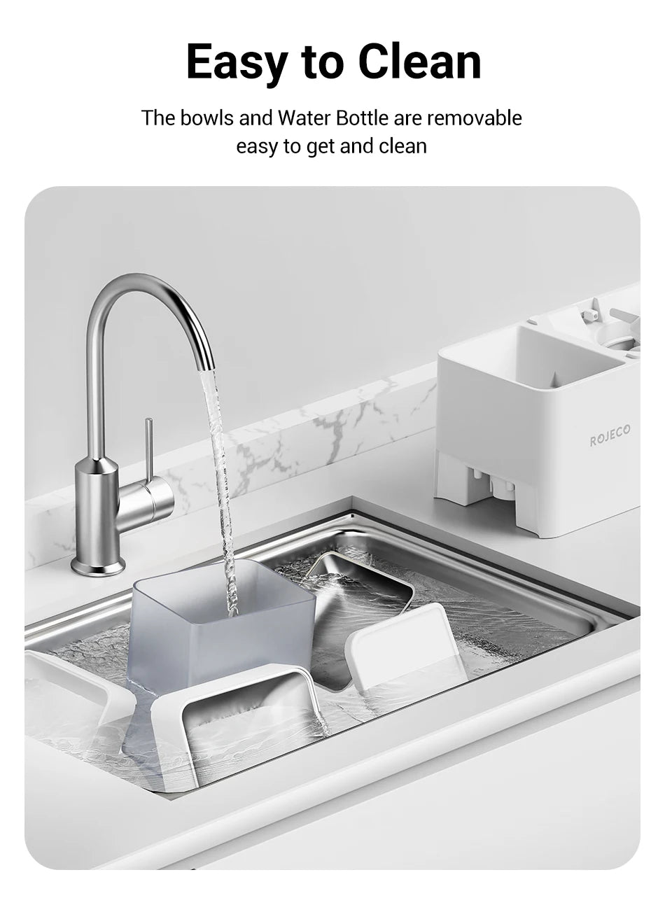 Kitchen sink with water flowing, featuring a removable bowl and water bottle, on a white background.